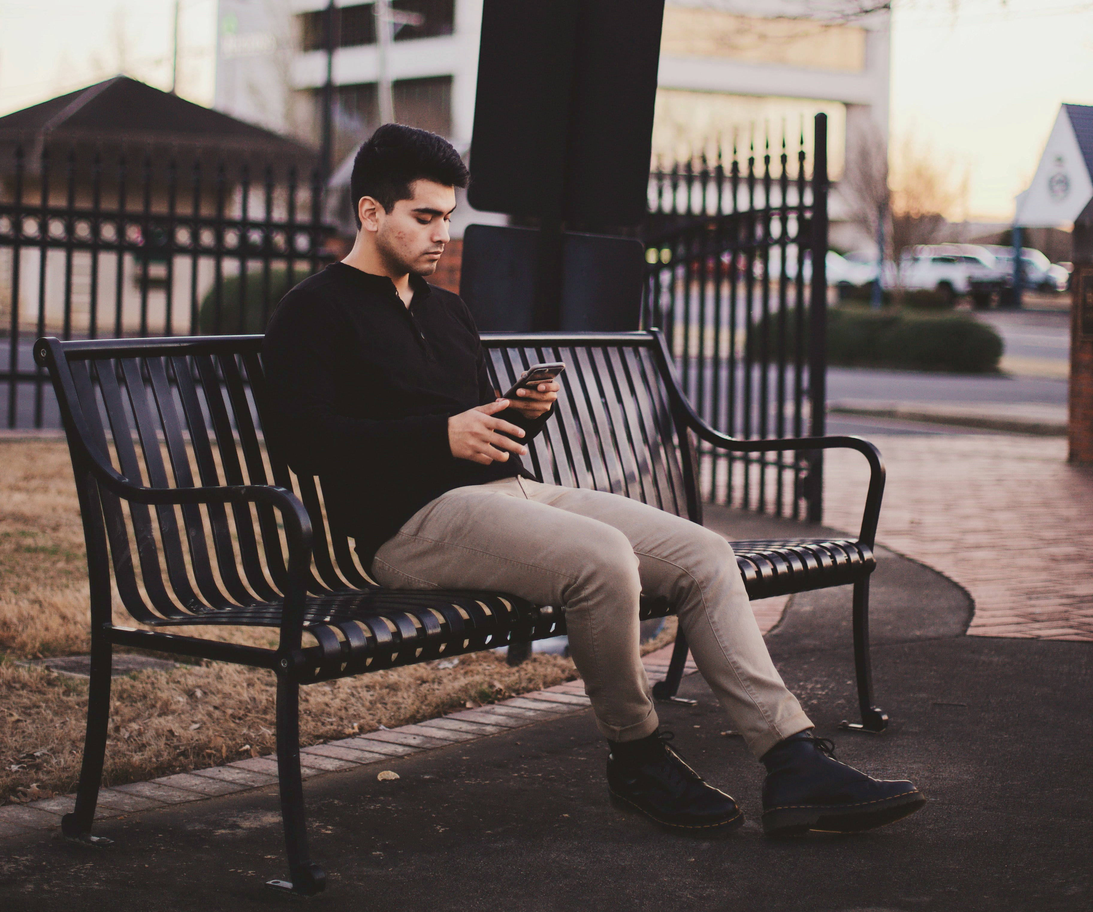 person sitting using their phone