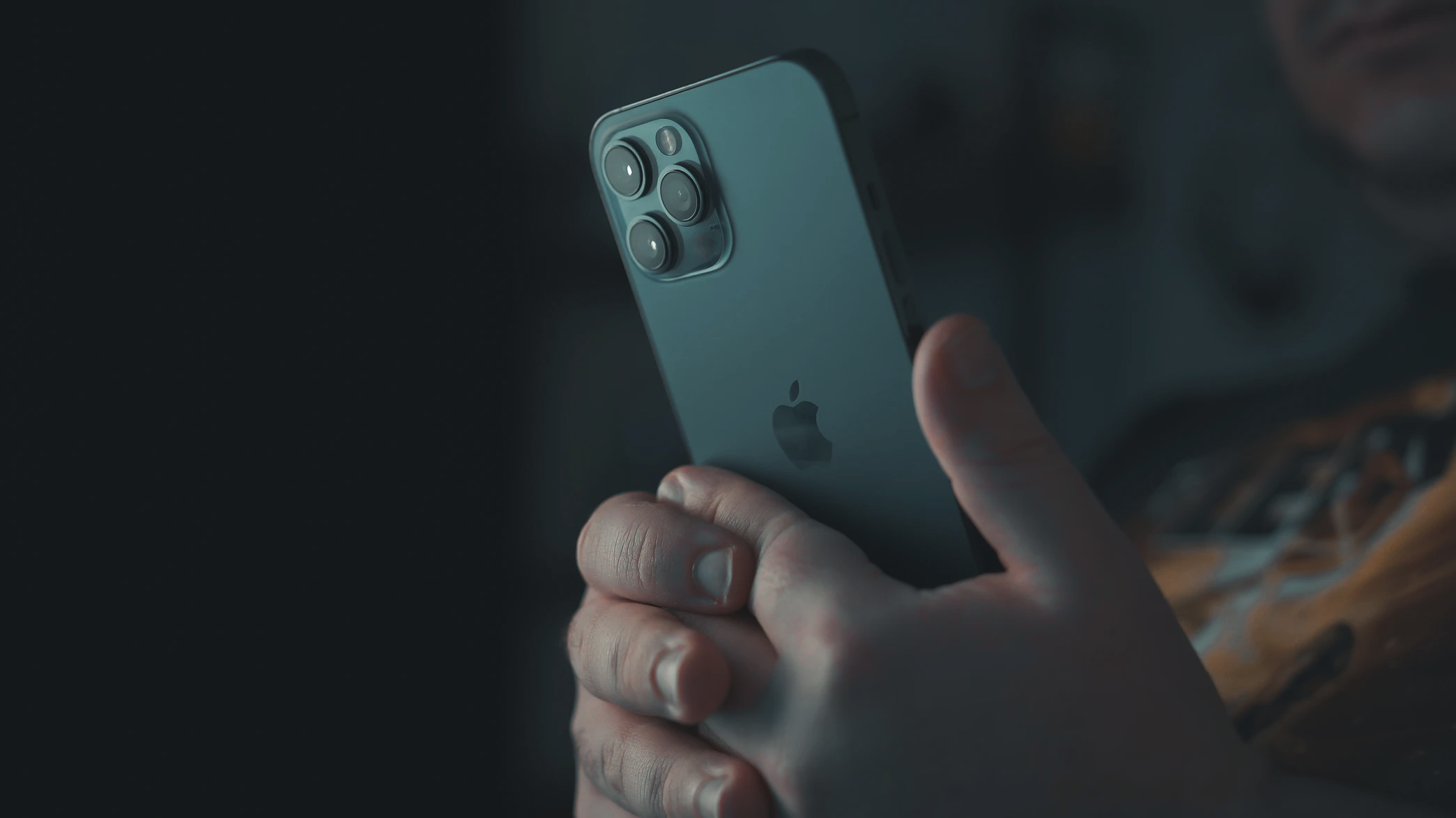 Person holding silver iPhone