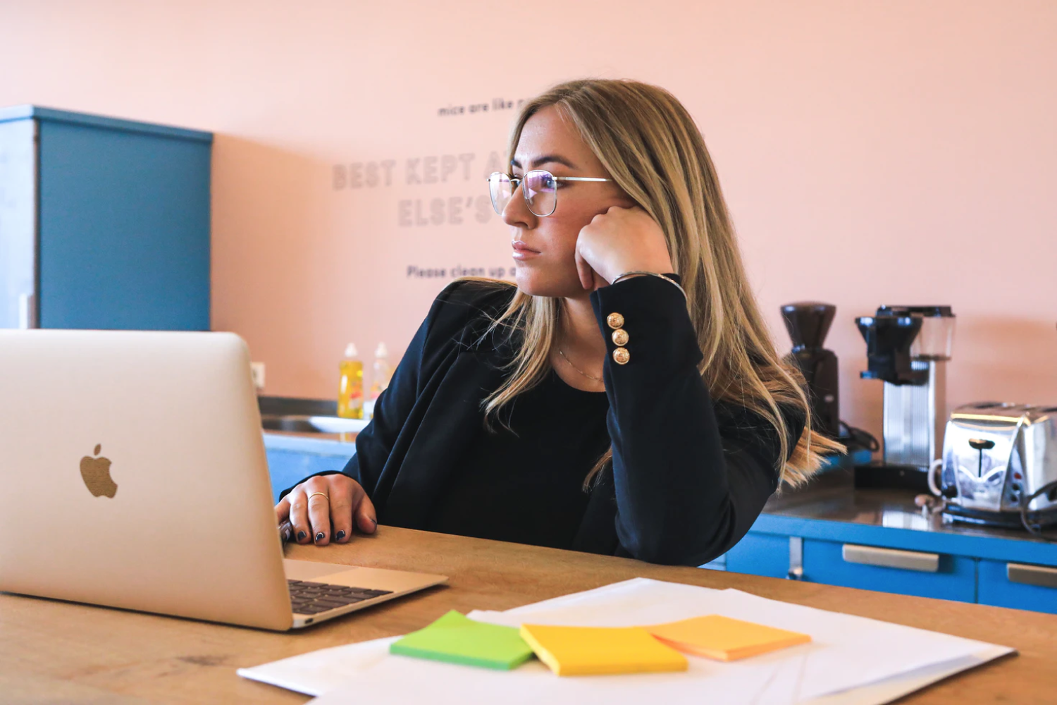 Woman thinking in front of a computer