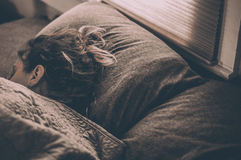 Person sleeping. Thanks to Lux Graves for sharing their work on Unsplash.
